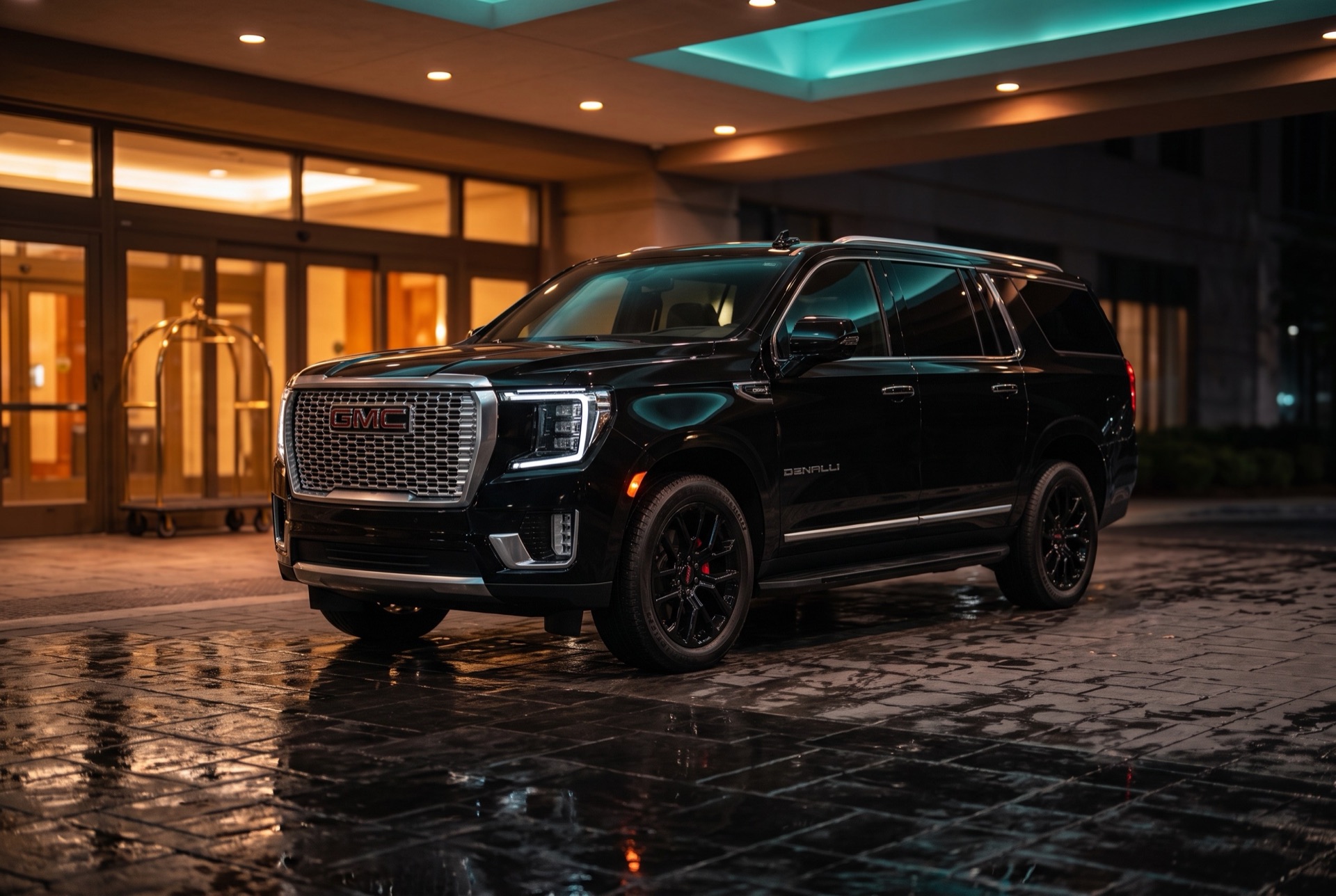 Black GMC Yukon Denali XL at a luxury hotel entrance in Atlanta